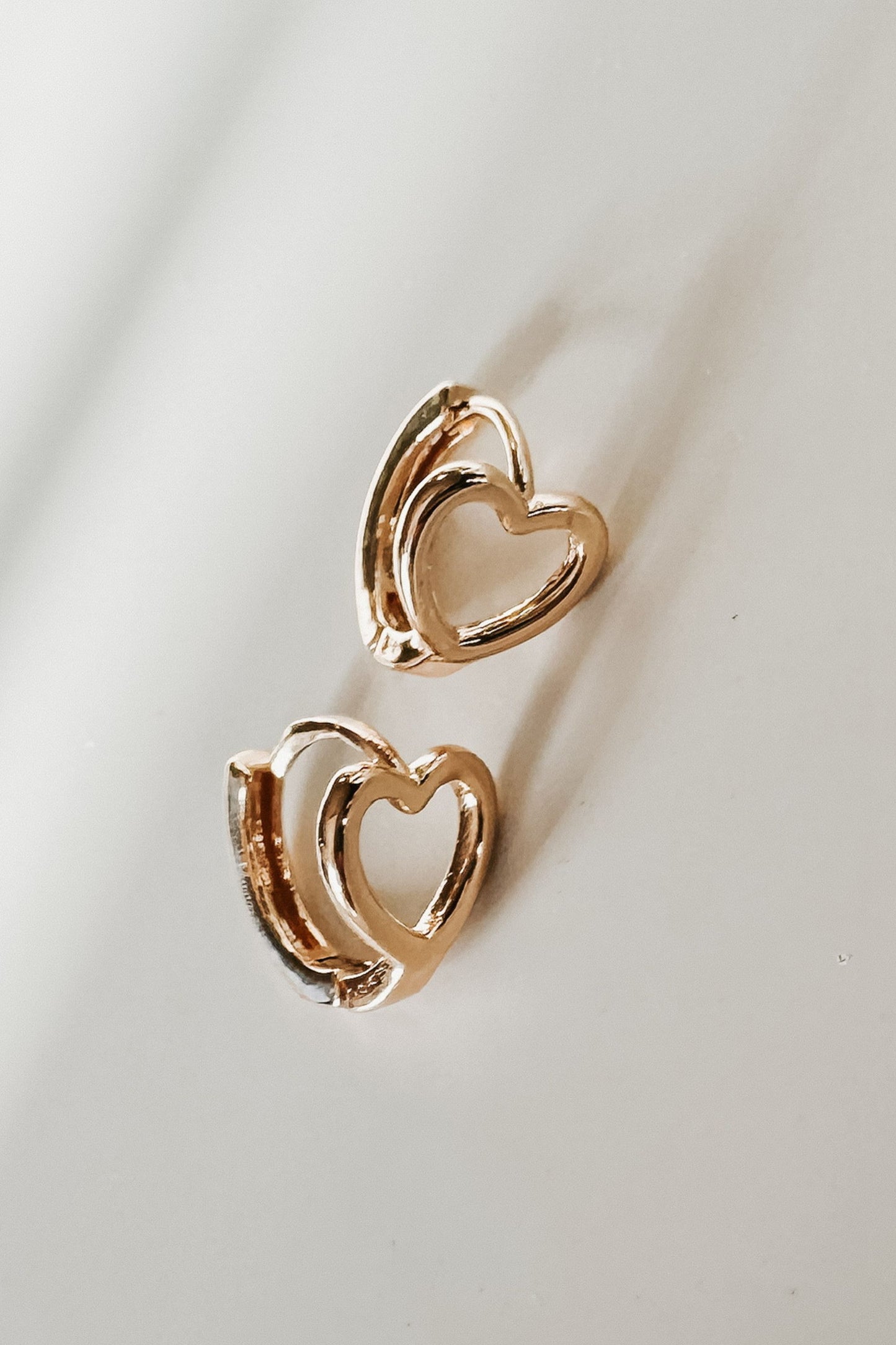 Gold Cutout Heart Huggie Earrings